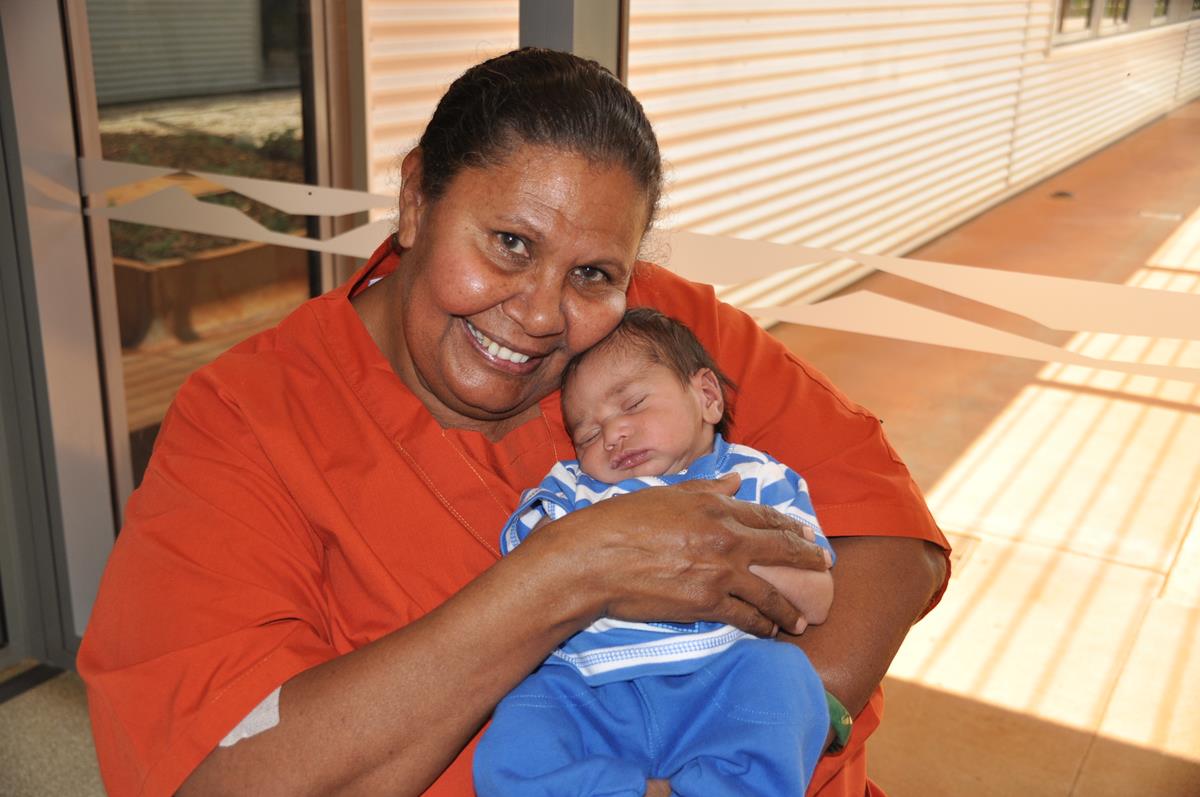 Aboriginal health worker and baby sleeping